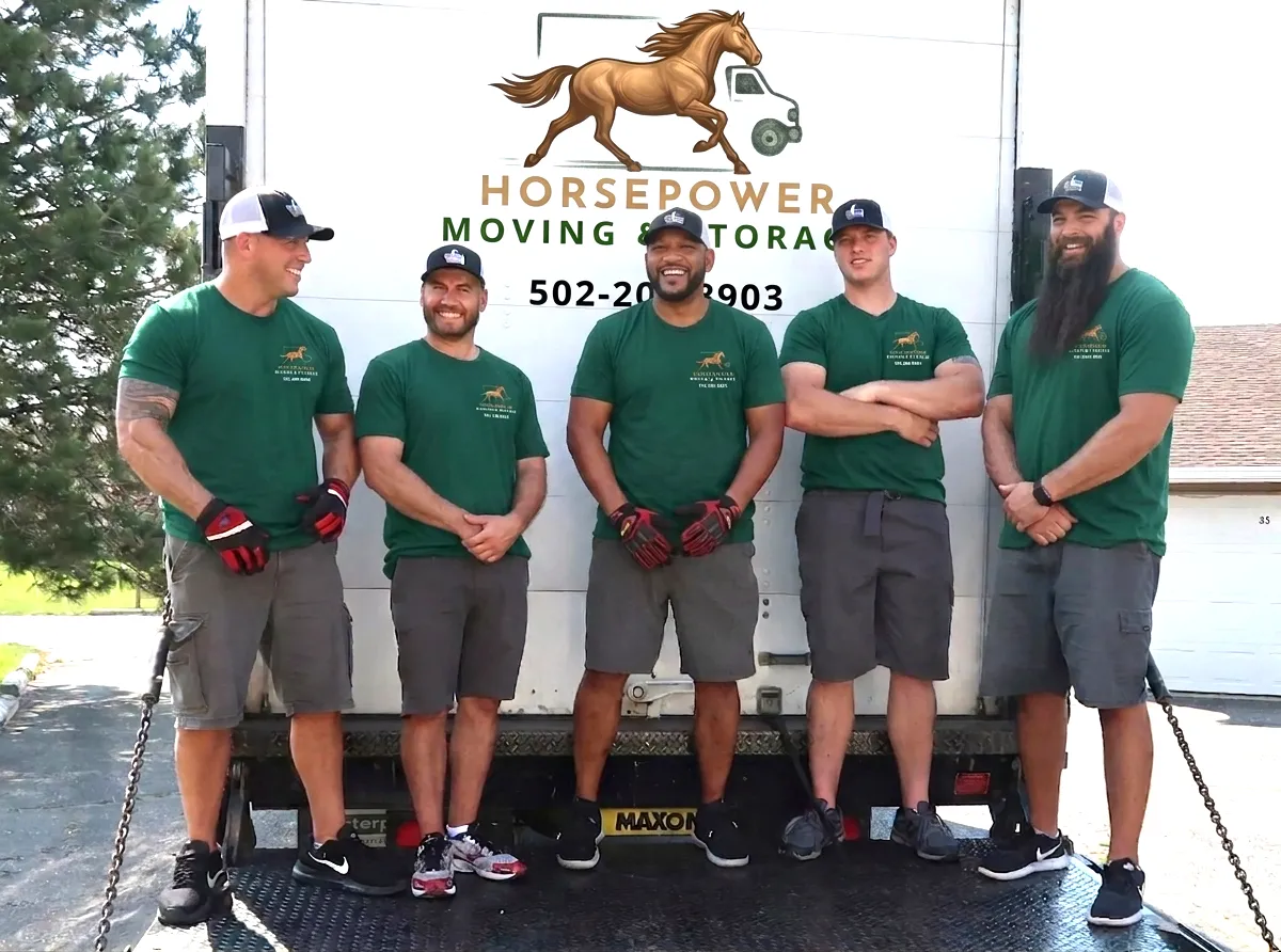 Five Horsepower Moving and Storage team members standing in front of a branded moving truck in Louisville, KY.