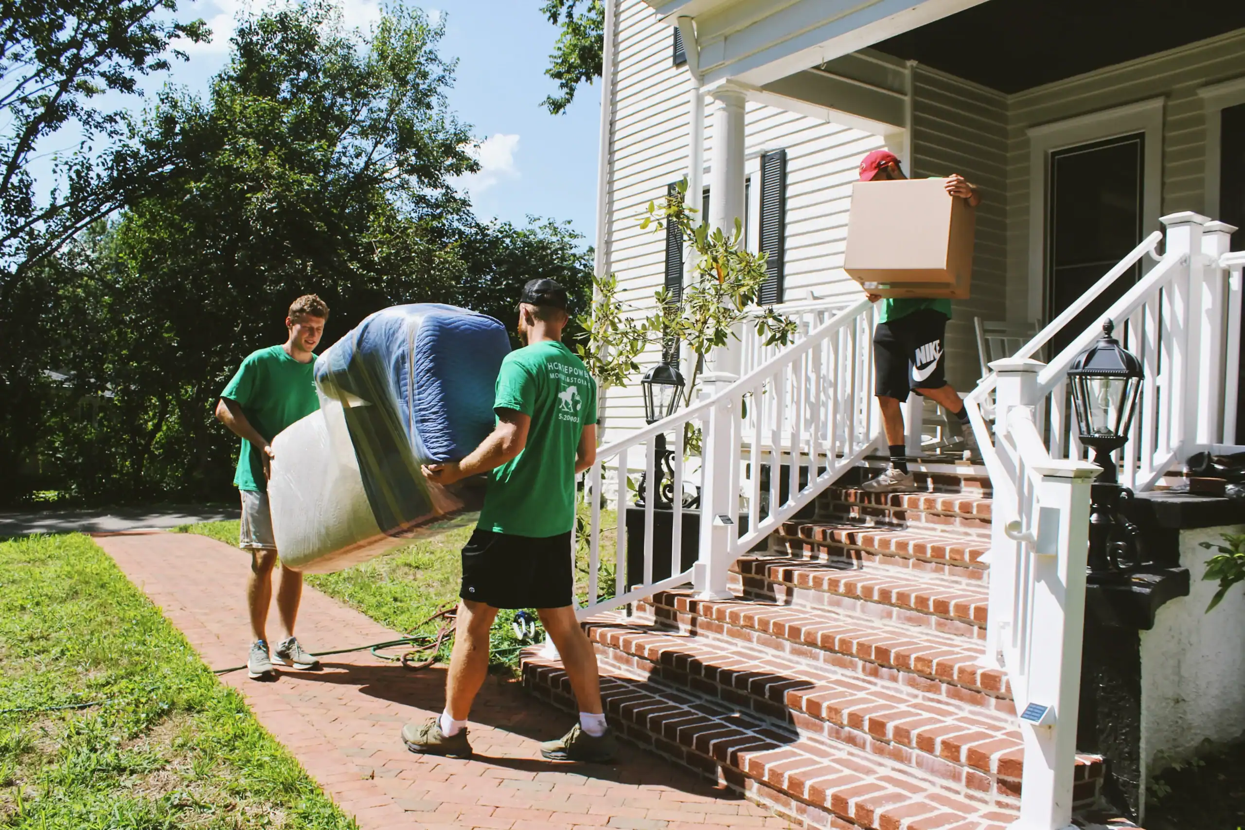 Horsepower Moving crew carrying furniture and boxes during a long-distance move